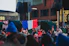 a crowd of people standing in front of a building