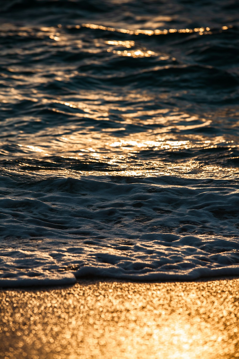 a close up of a wave on a beach