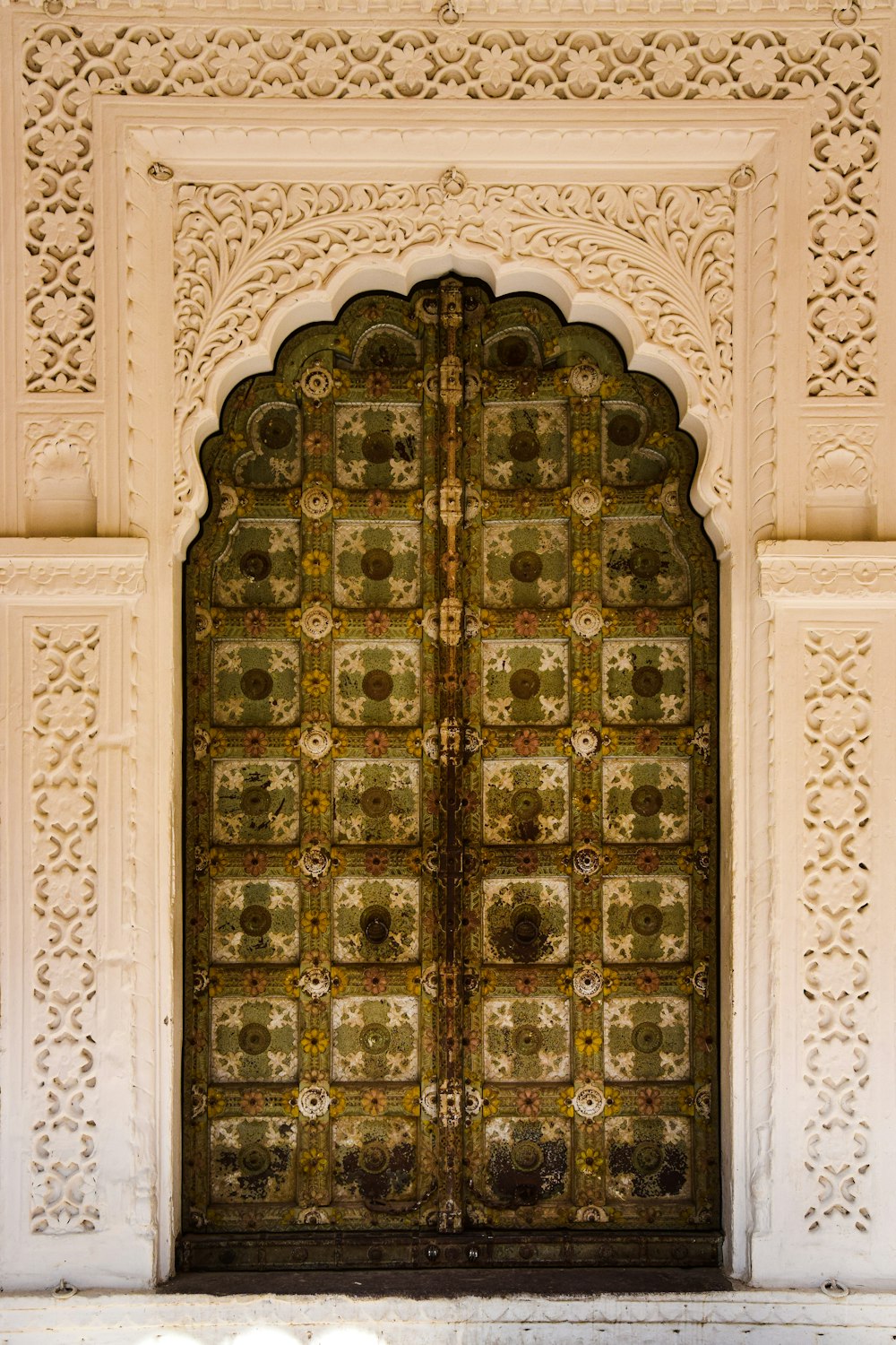 a large wooden door with intricate carvings on it