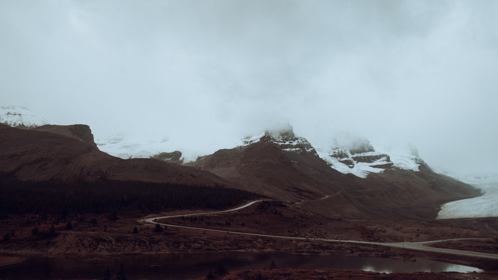 a mountain range with a road winding through it