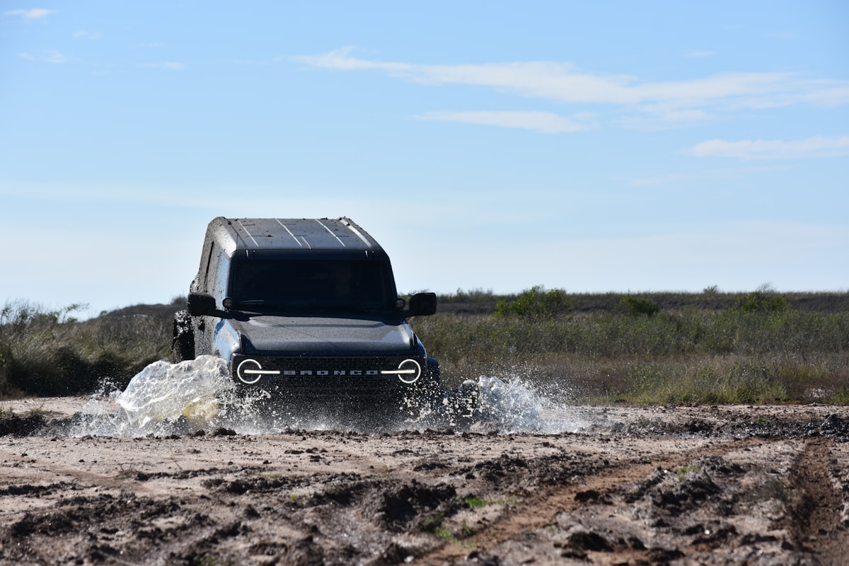 Off-road vehicle with winch during trail recovery operation