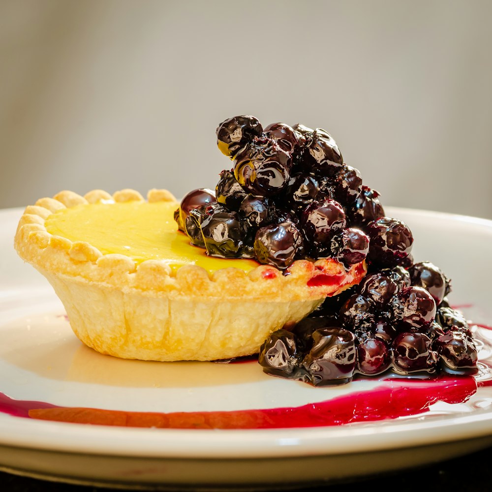 a piece of pie with blueberries on a plate