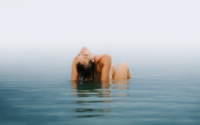Close-up of a peaceful person gently resting inside a float pod.