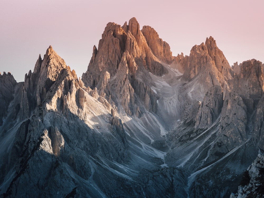 a very tall mountain with some snow on it