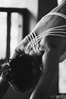 Fitness enthusiast stretching while wearing a back support that contours comfortably to the lower back.