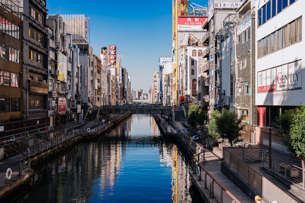 a river running through a city next to tall buildings