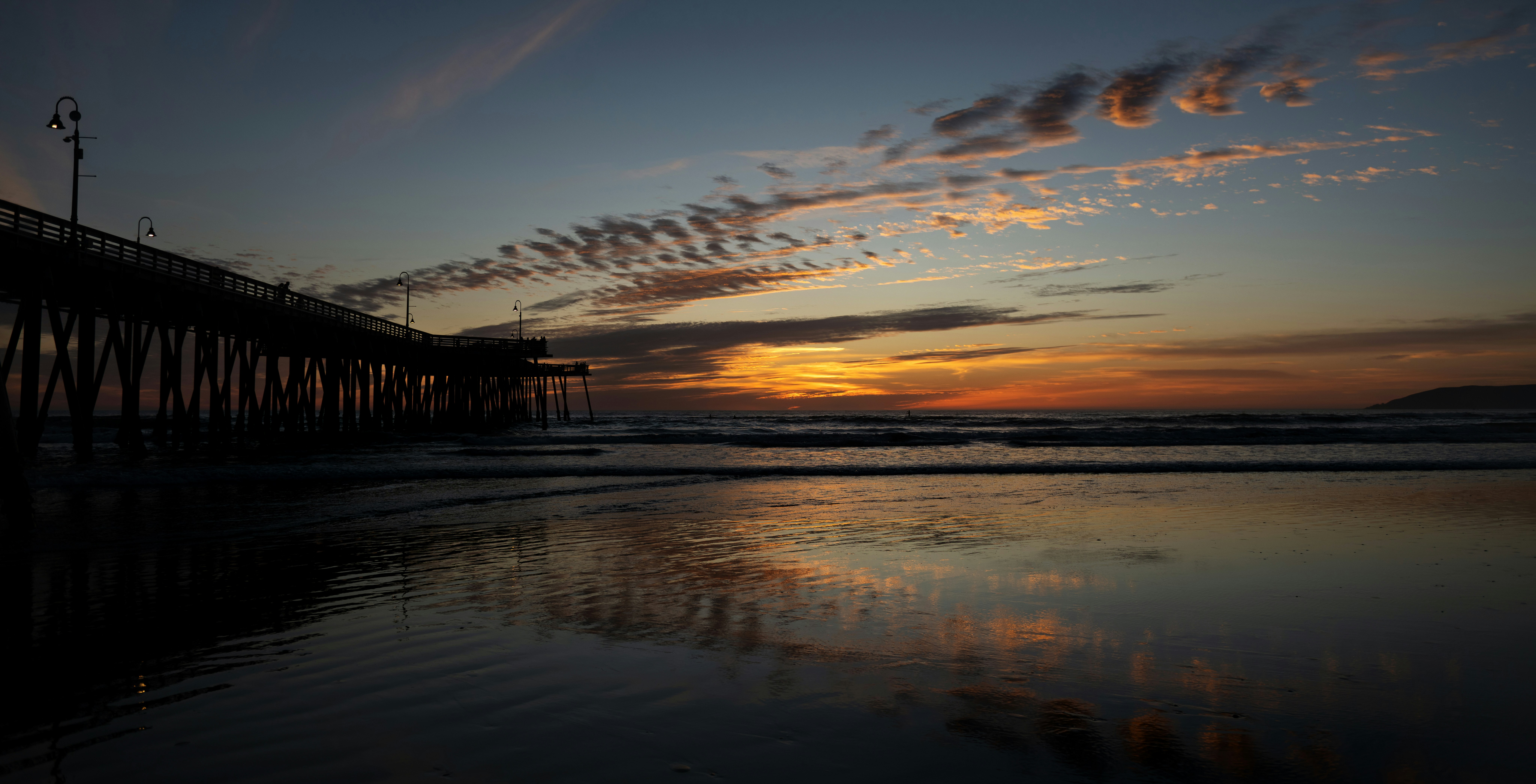 a pier that is next to a body of water