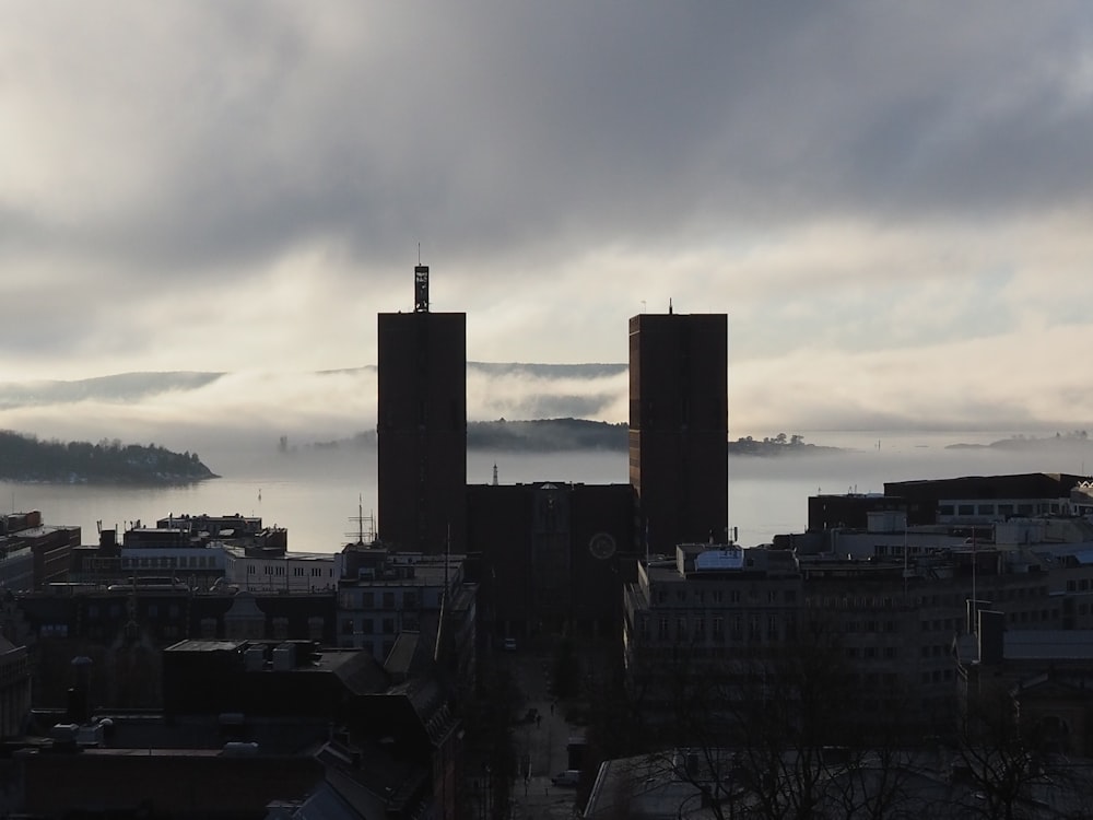 a view of a city with fog in the distance