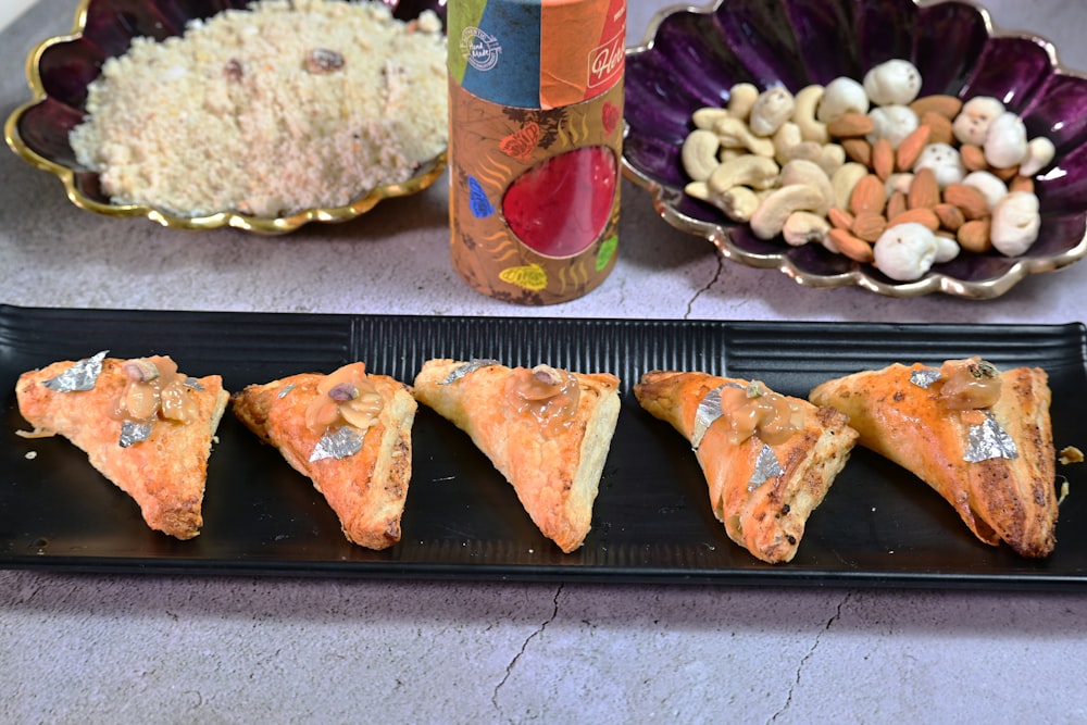 a plate of food and a can of soda on a table