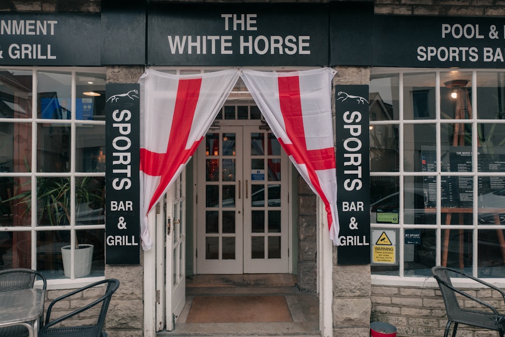 the entrance to the white horse sports bar and grill