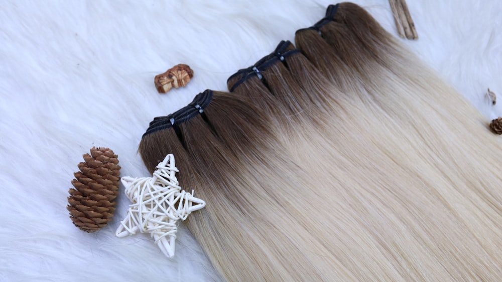 a white fur with some pine cones and a pair of scissors