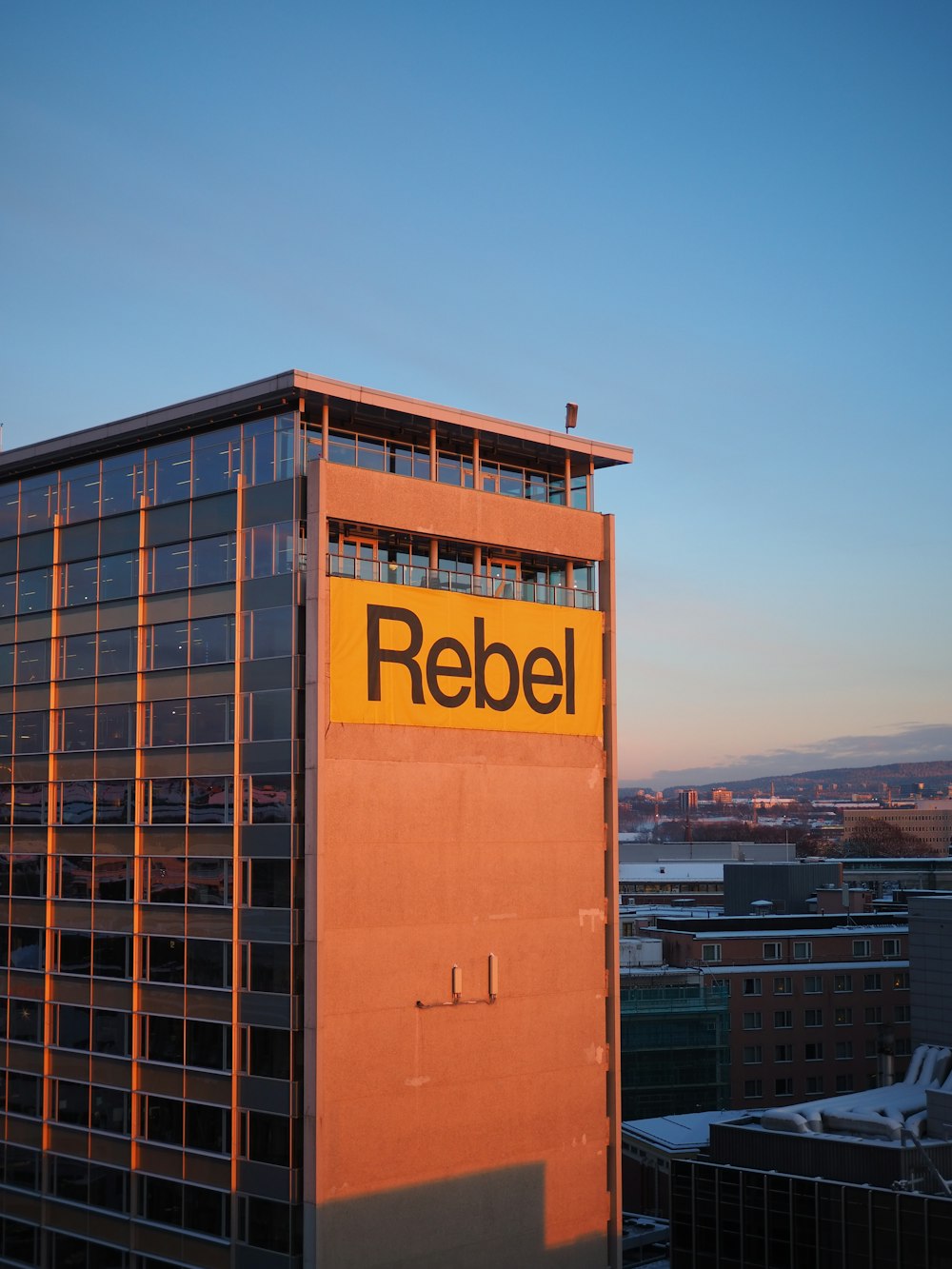 a tall building with a sign on the side of it