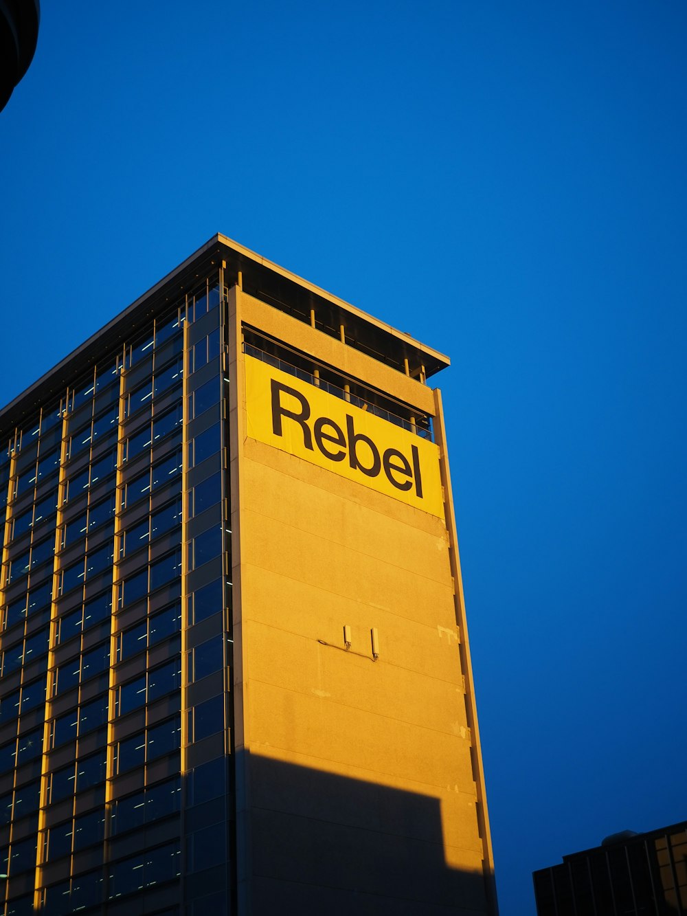 a tall building with a sign on the side of it