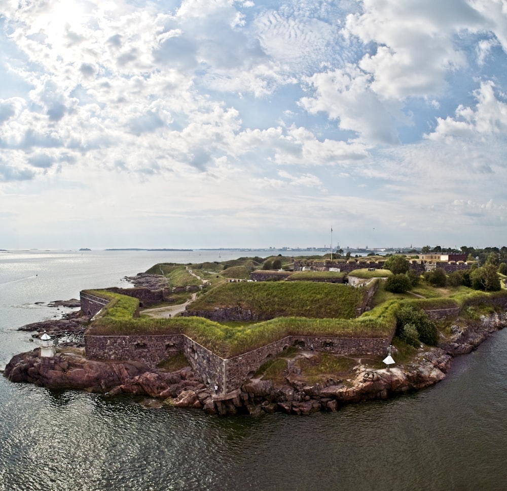 an aerial view of a small island in the middle of the ocean