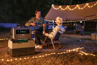 a man playing music in an area with outdoor solar lighting