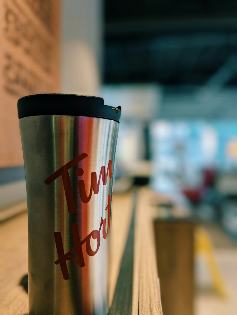 a coffee cup sitting on top of a wooden table