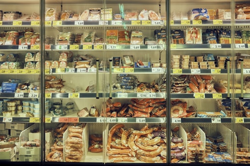 a display case filled with lots of different types of food