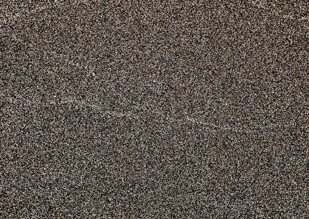 a close up view of a black and brown textured surface