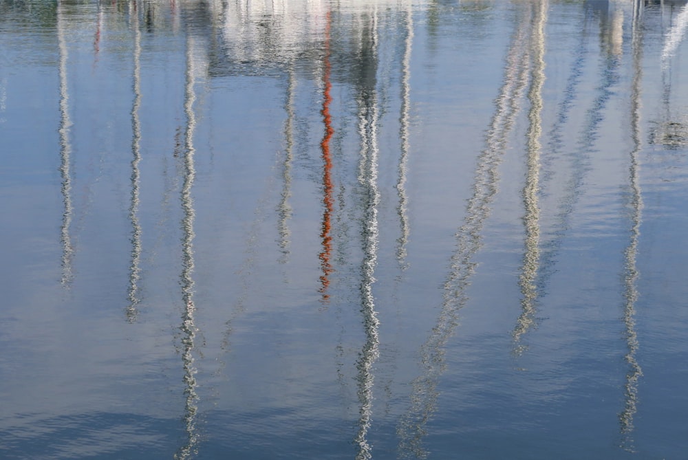 the reflection of a boat in the water