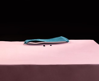 a pink table with a blue cloth on top of it