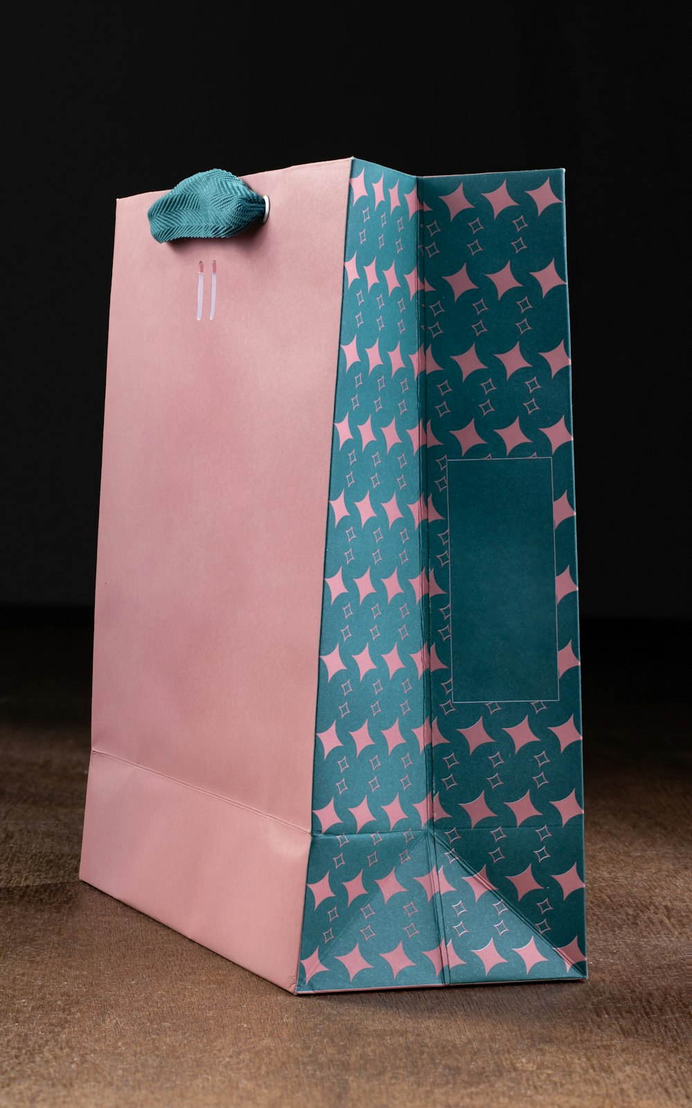a pink and blue shopping bag with stars on it