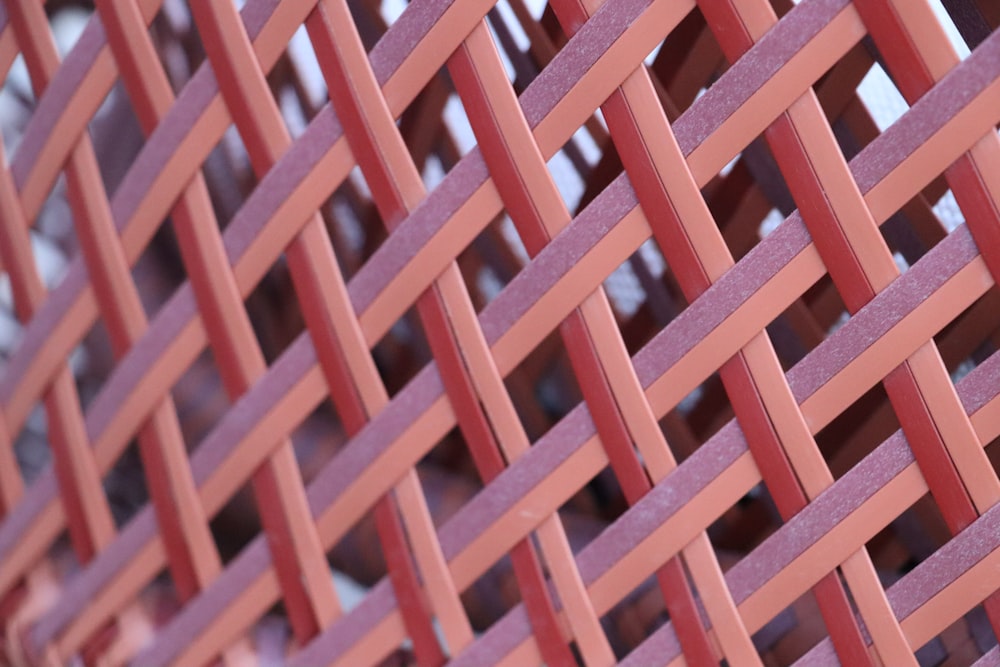 a close up of a red metal fence