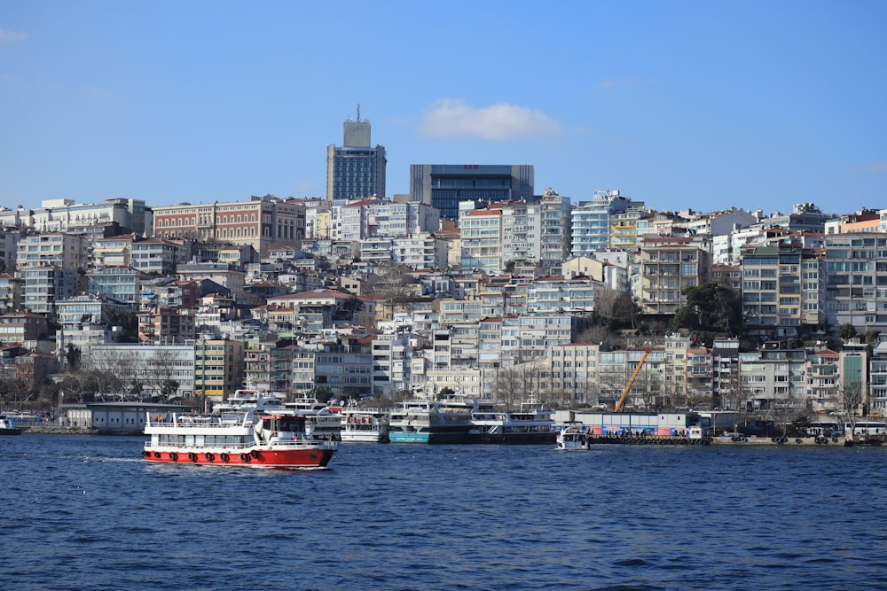 a red and white boat in a body of water