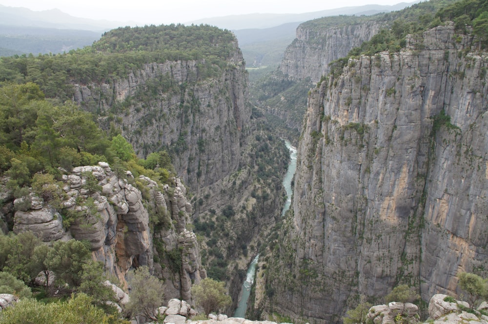 a view of a canyon with a river running through it