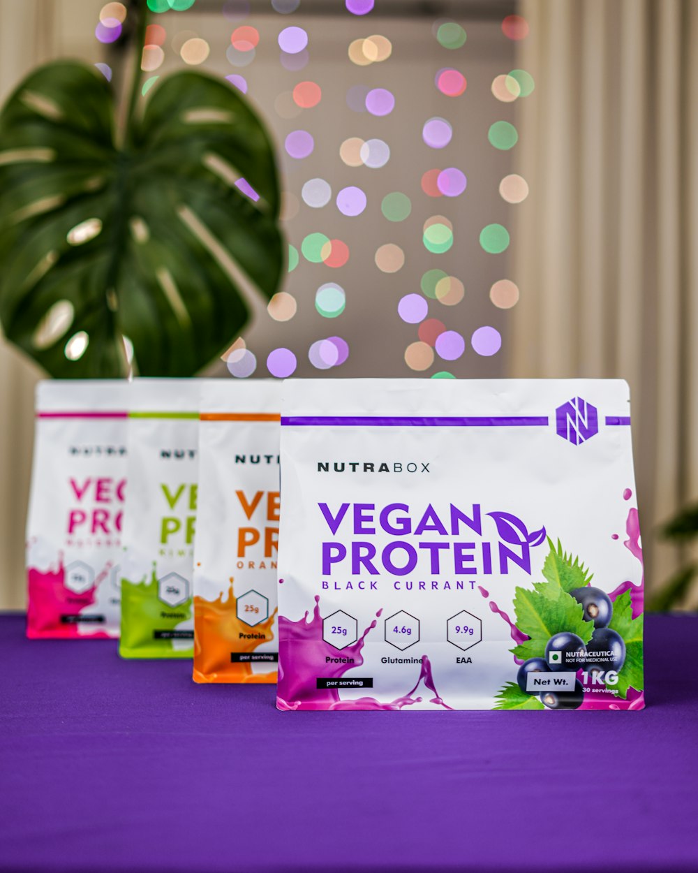 vegan protein packets sitting on a purple table