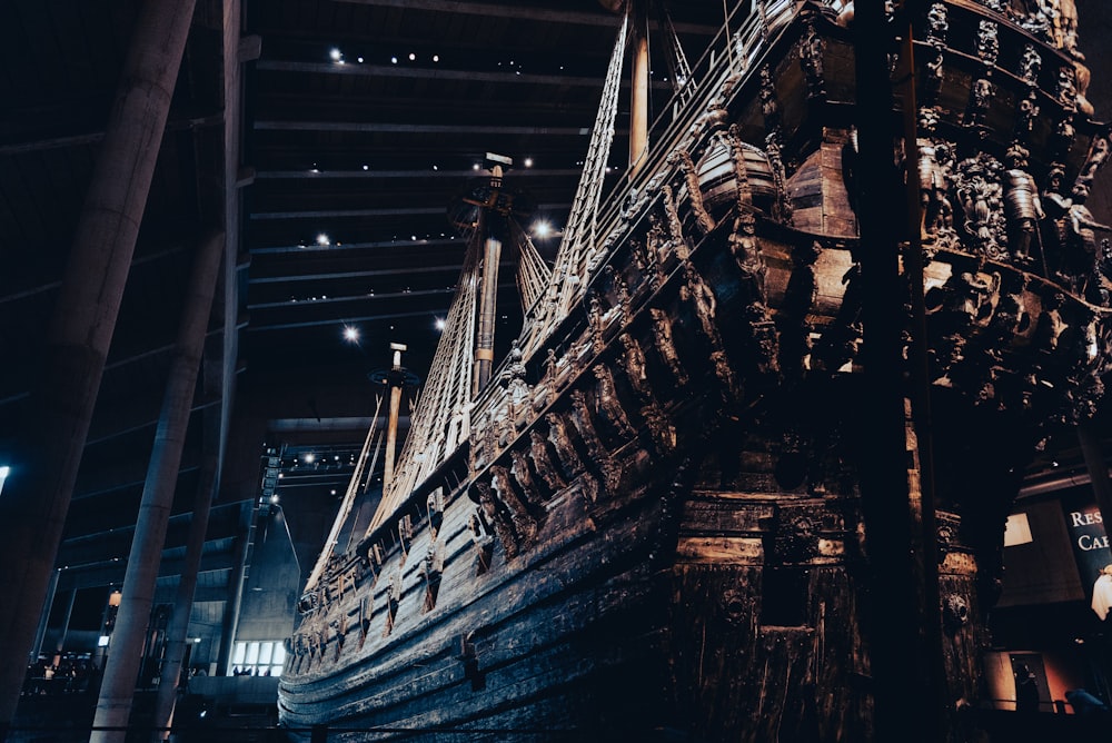 a large wooden boat in a building