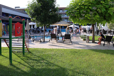A vibrant community pool and clubhouse area perfect for family gatherings.