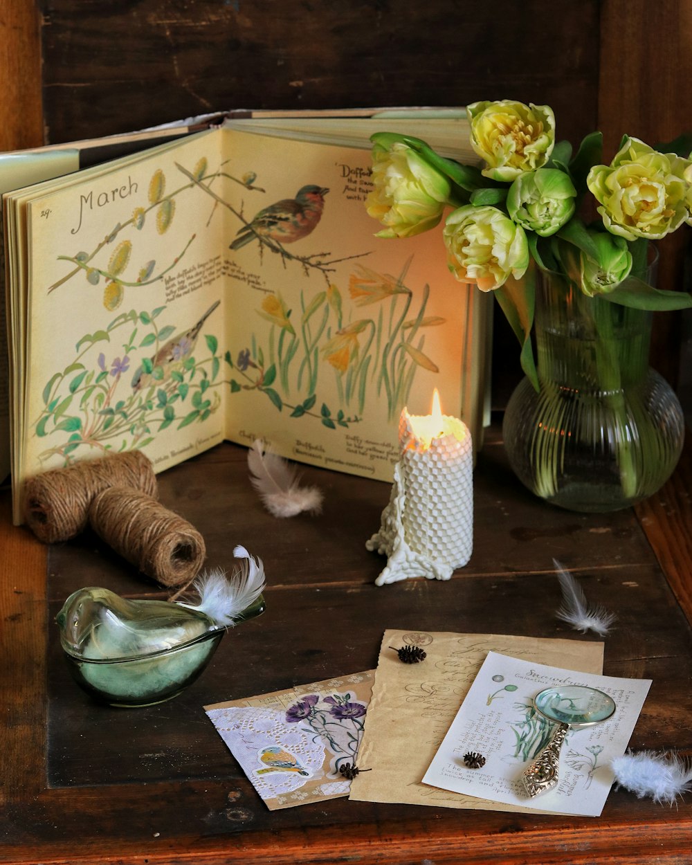 a wooden table topped with a vase filled with flowers