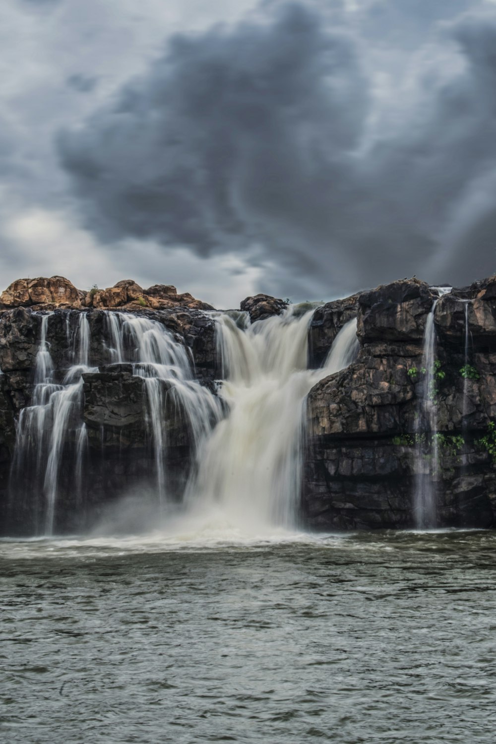 a large waterfall with lots of water coming out of it