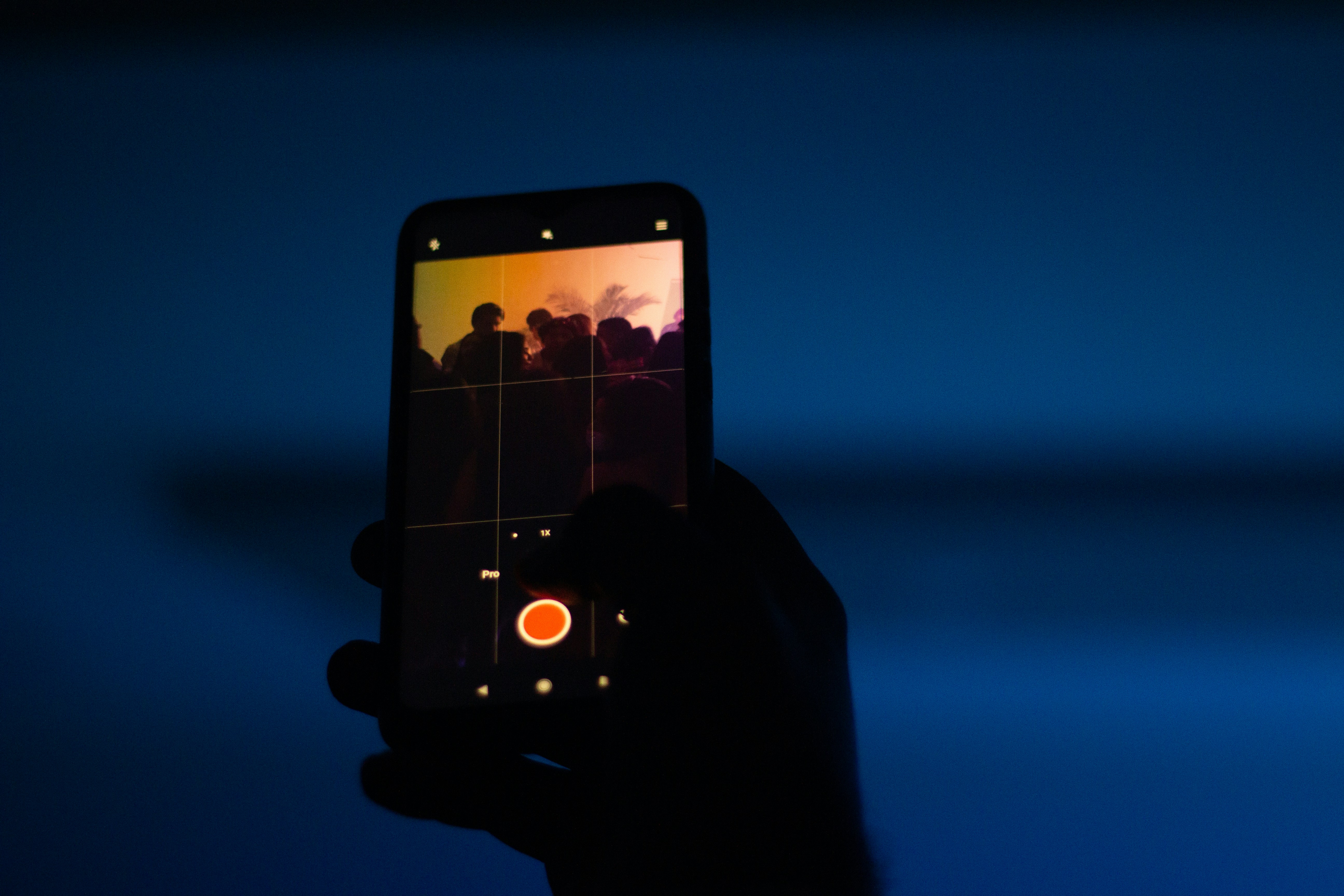 a person holding a cell phone in their hand