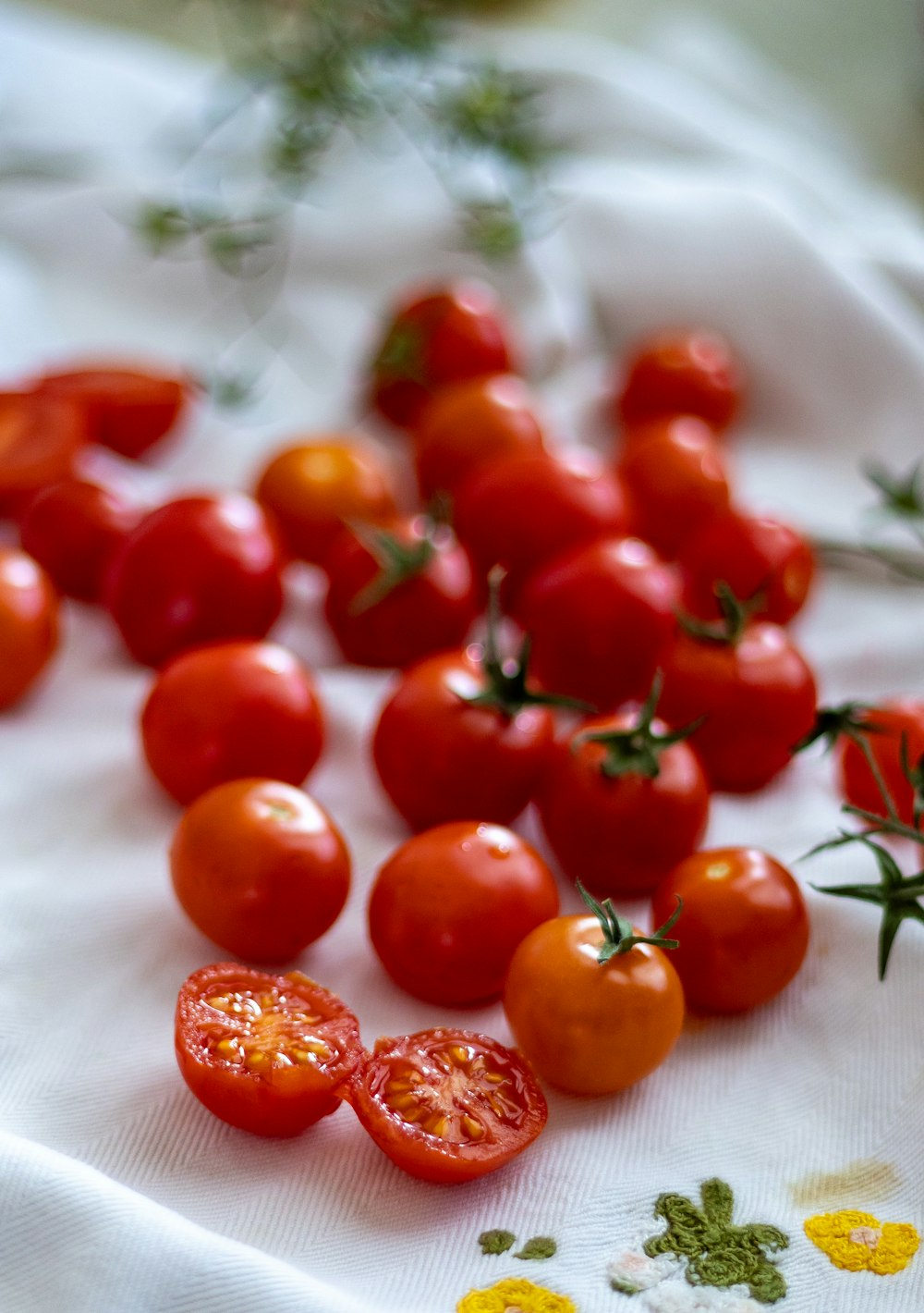 a bunch of tomatoes that are on a table