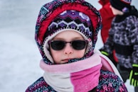 A child wearing a trendy winter coat from Hark Wear.