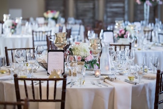a table is set up for a formal dinner