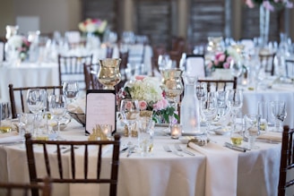 a table is set up for a formal dinner
