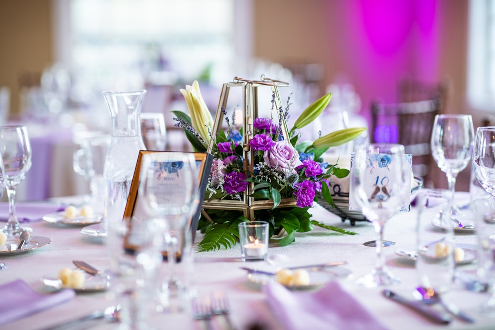 a table with a basket of flowers on top of it