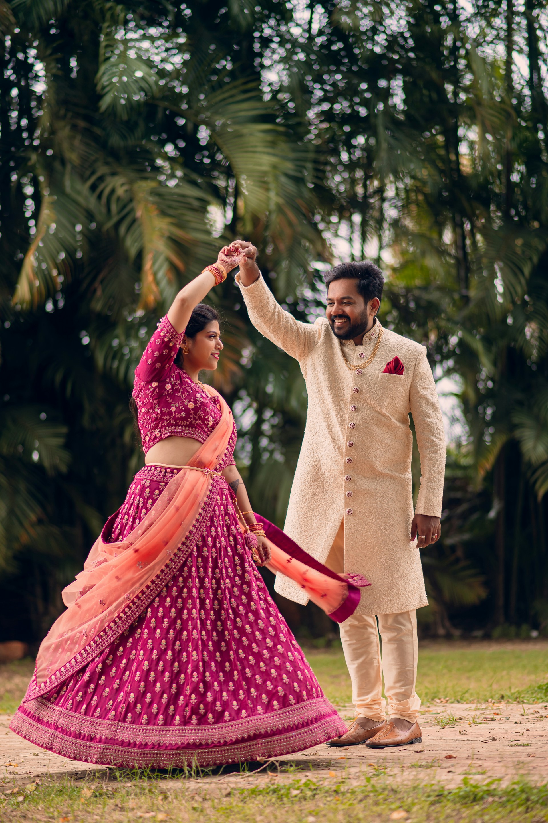 a man and a woman dancing in a field