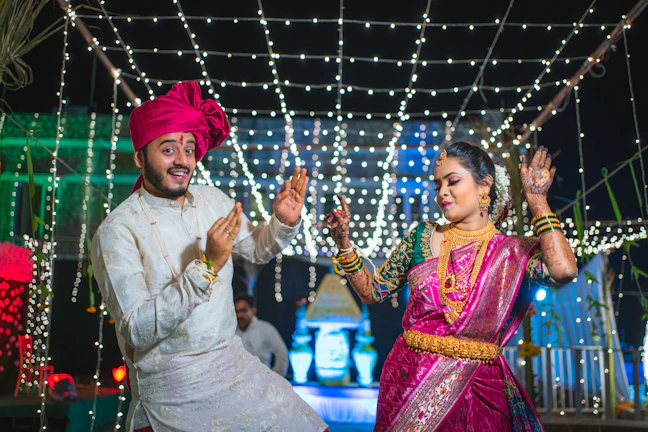 a man and woman dancing in front of lights