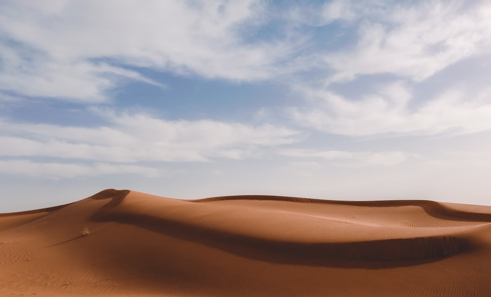 a large sand dune in the middle of a desert