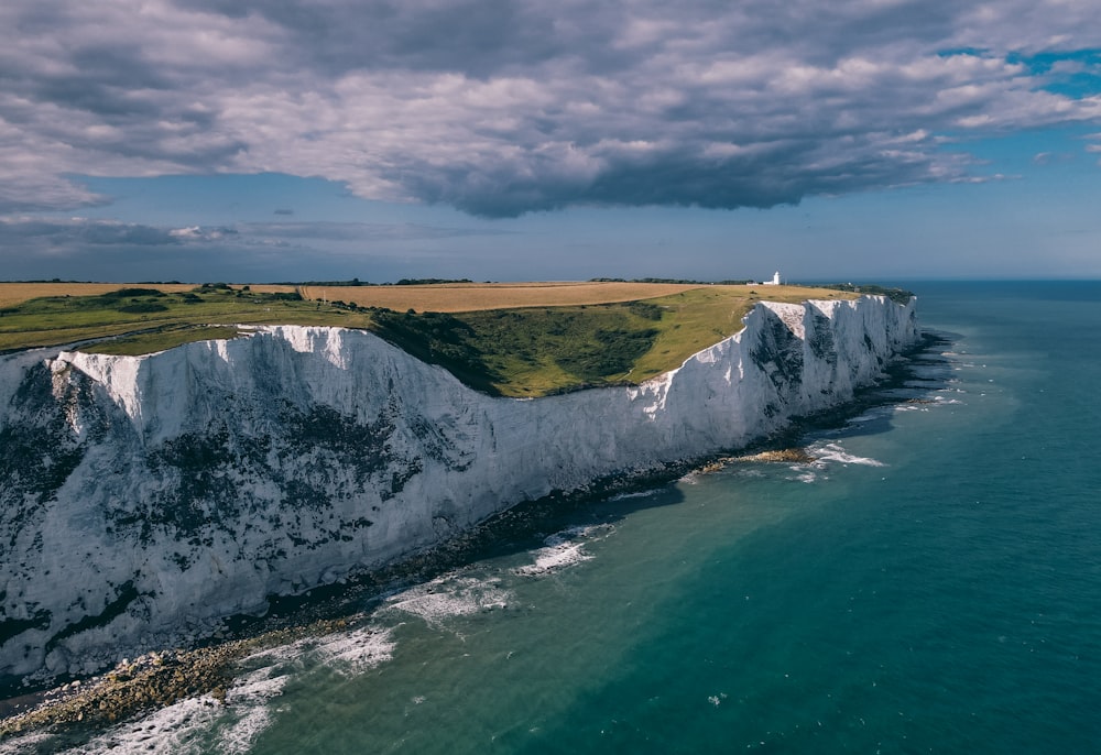 an aerial view of the white cliffs of the coast