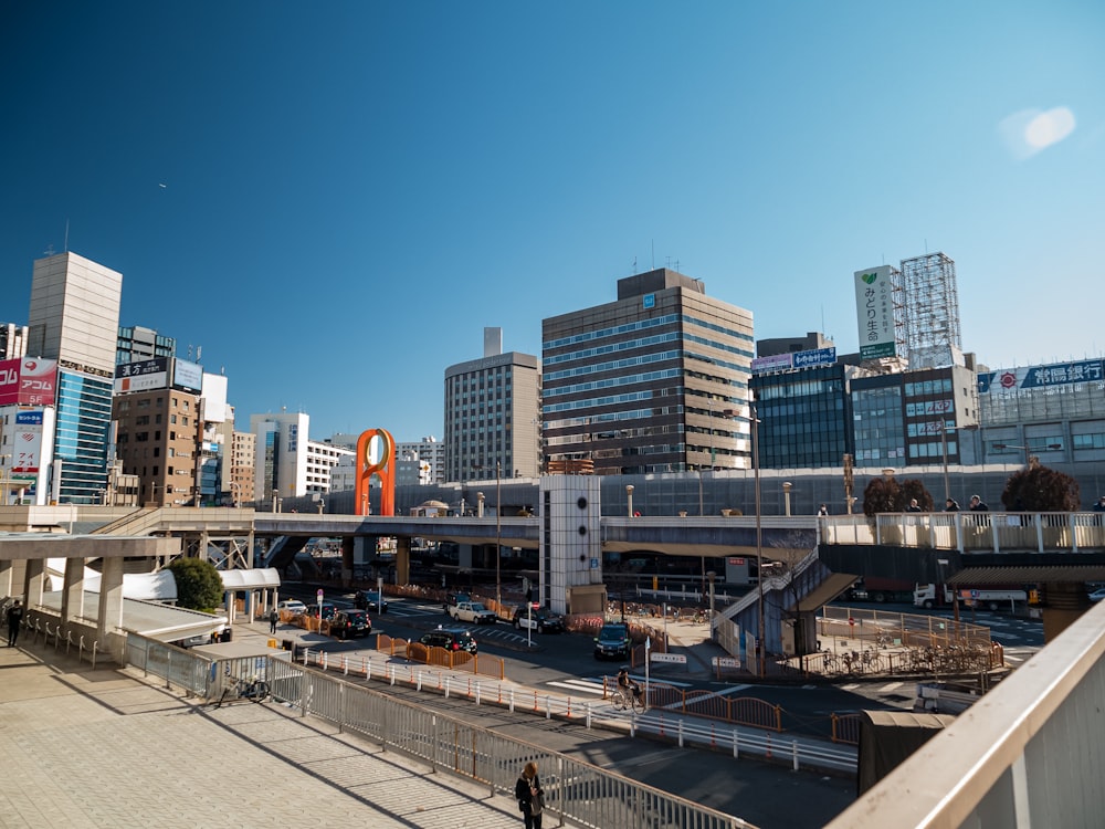 a city with tall buildings and a bridge