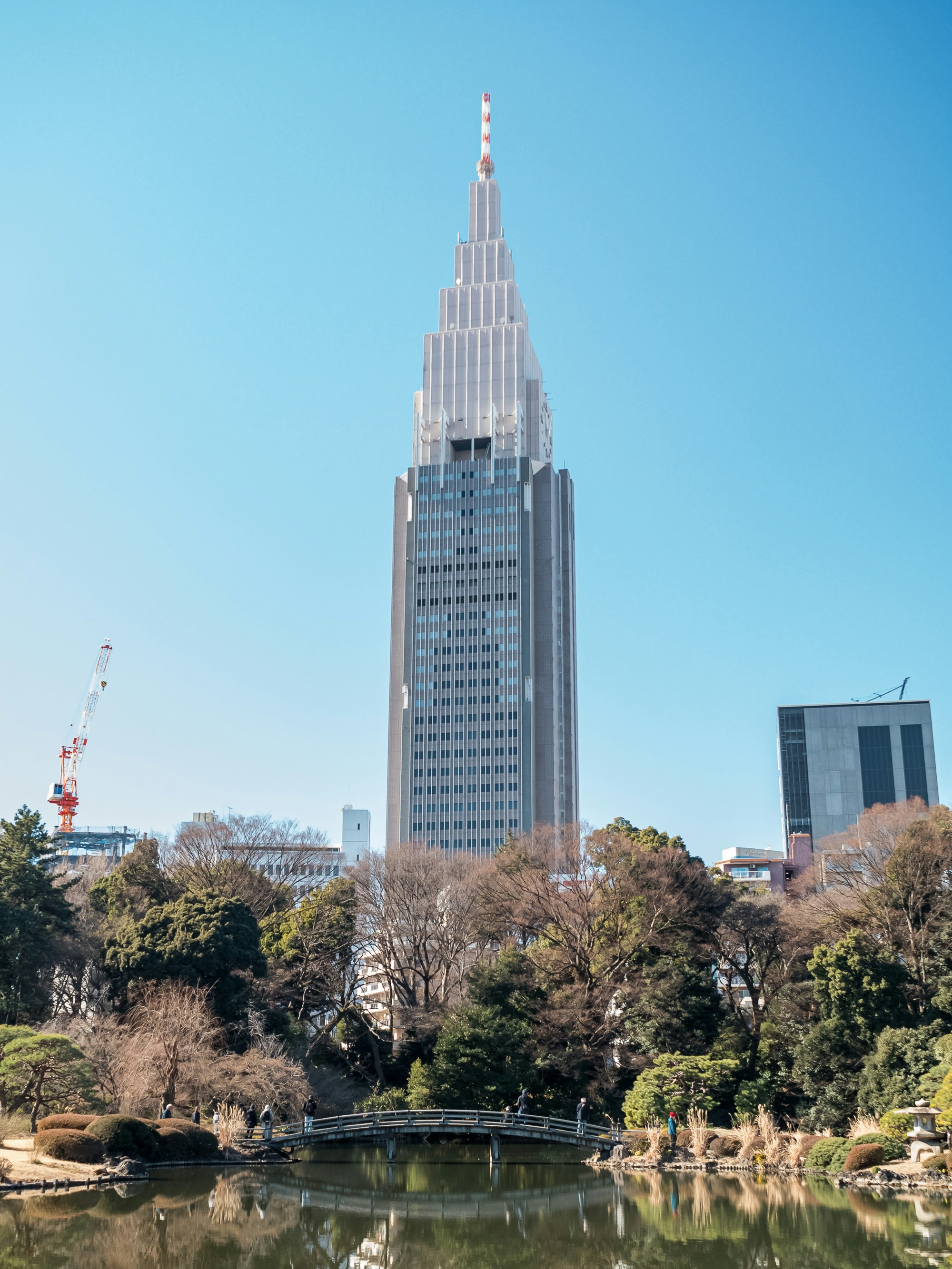 a view of a building from across a pond