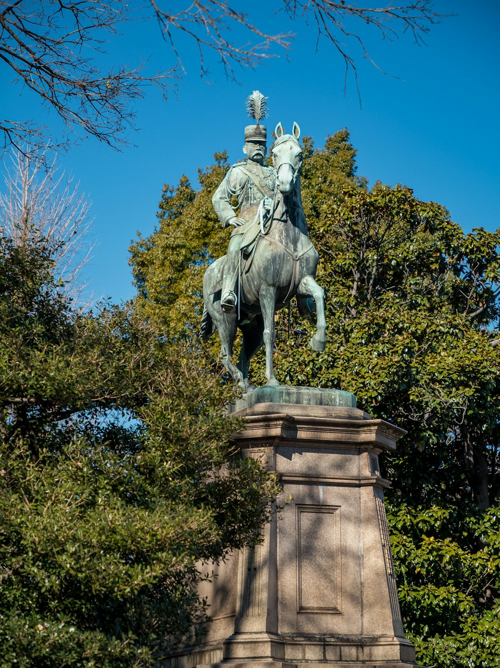 a statue of a man riding a horse