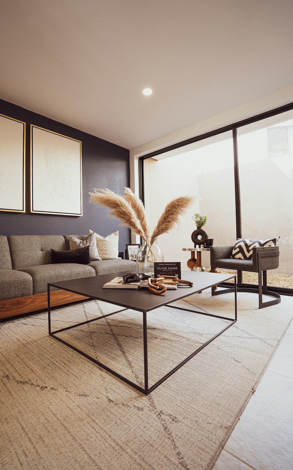 a living room filled with furniture and a large window