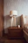 Cozy bedroom corner showcasing a custom wooden wardrobe and matching side table.