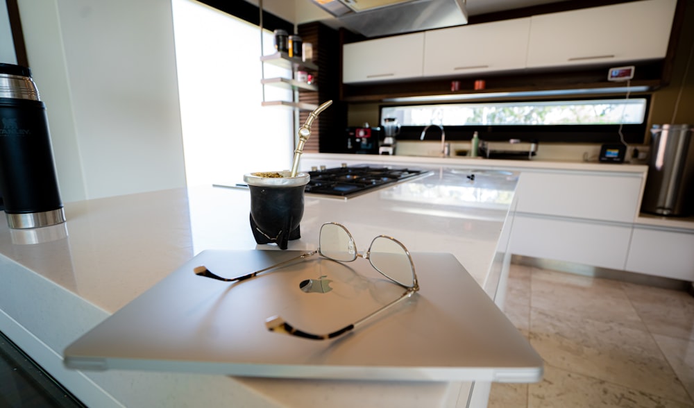 an open laptop computer sitting on top of a counter