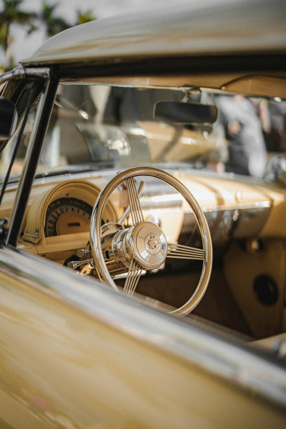 the interior of a car with a steering wheel and dashboard